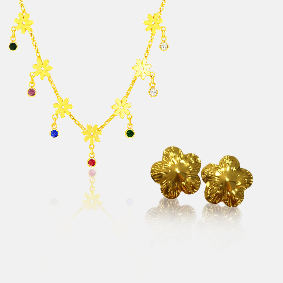 Gold necklace and earrings on a white background